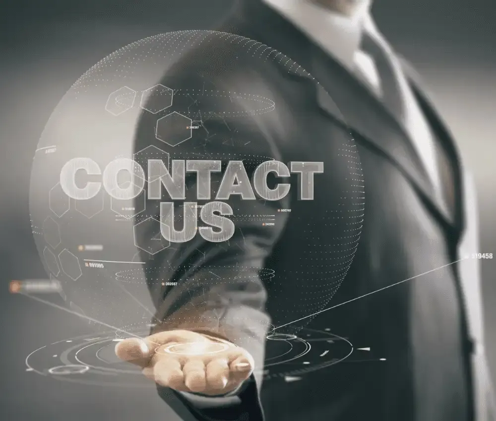 NEXSYS Contact Us - Man in Suit Holding Virtual 'Contact Us' Button
